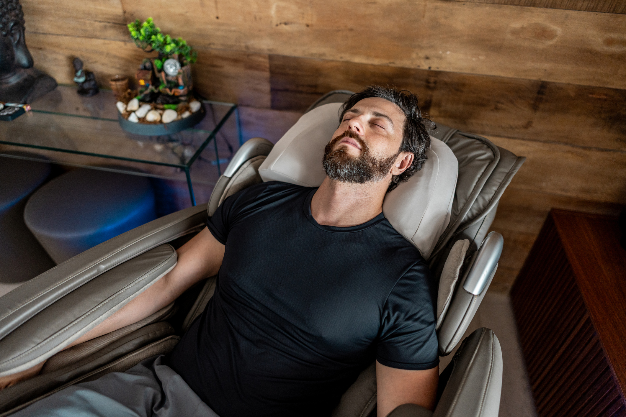 A man relaxing in an at-home massage chair